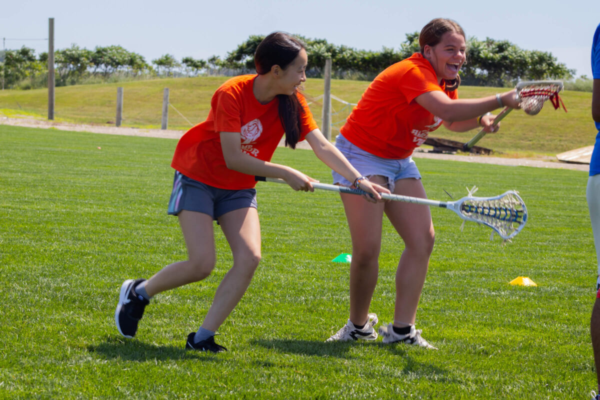 Campers playing lacrosse