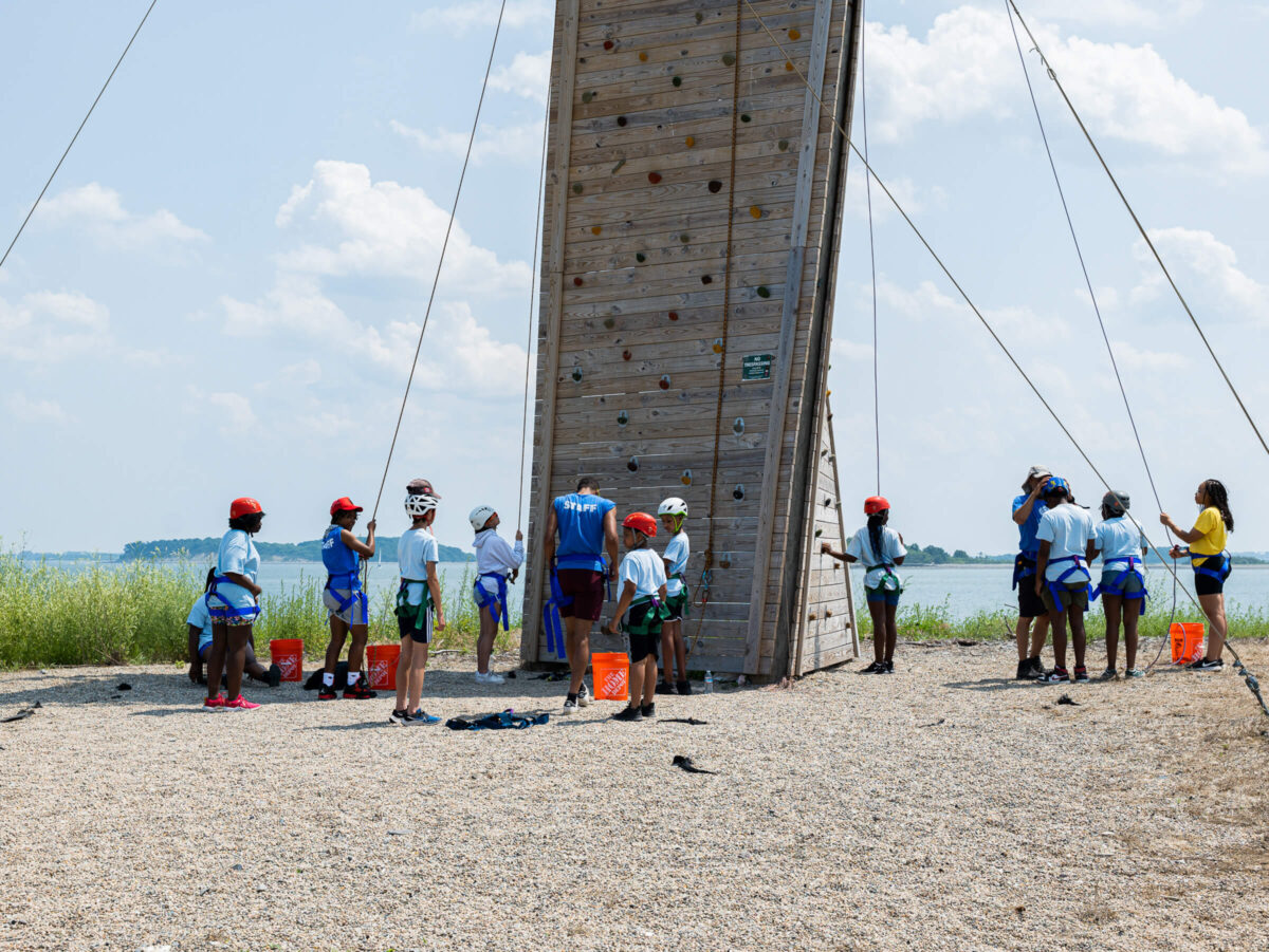Campers getting ready to rock climb