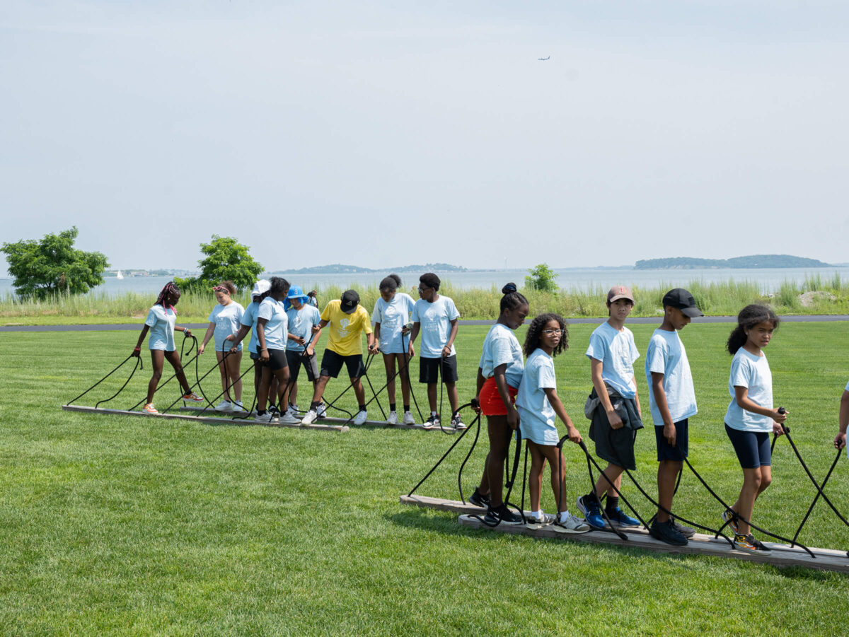 Campers practice a teamwork activity