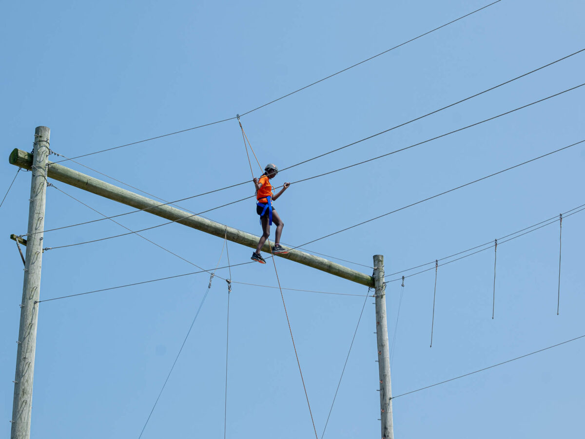 Camper on high ropes course
