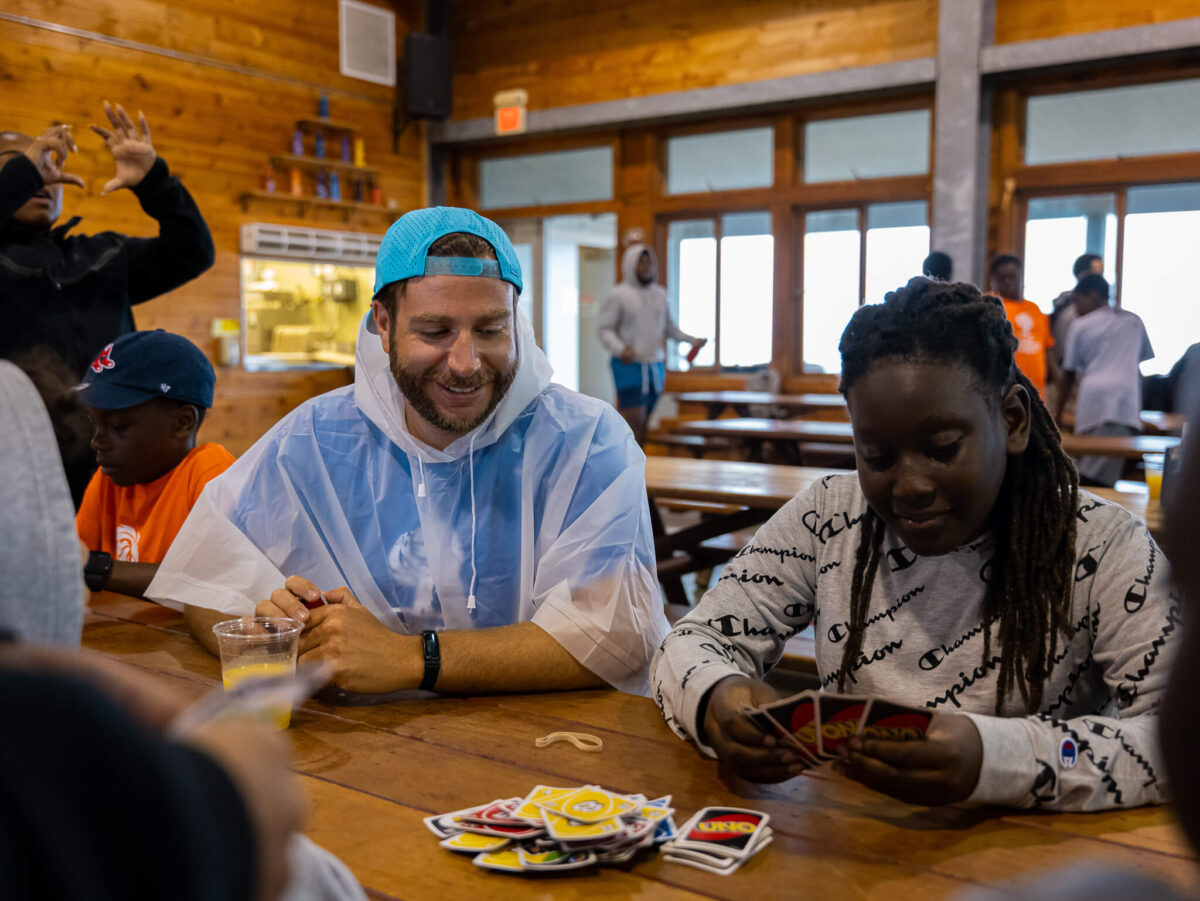 Campers and staff playing card game