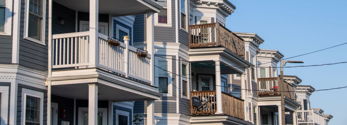A row of triple decker homes in Jamaica Plain, Boston
