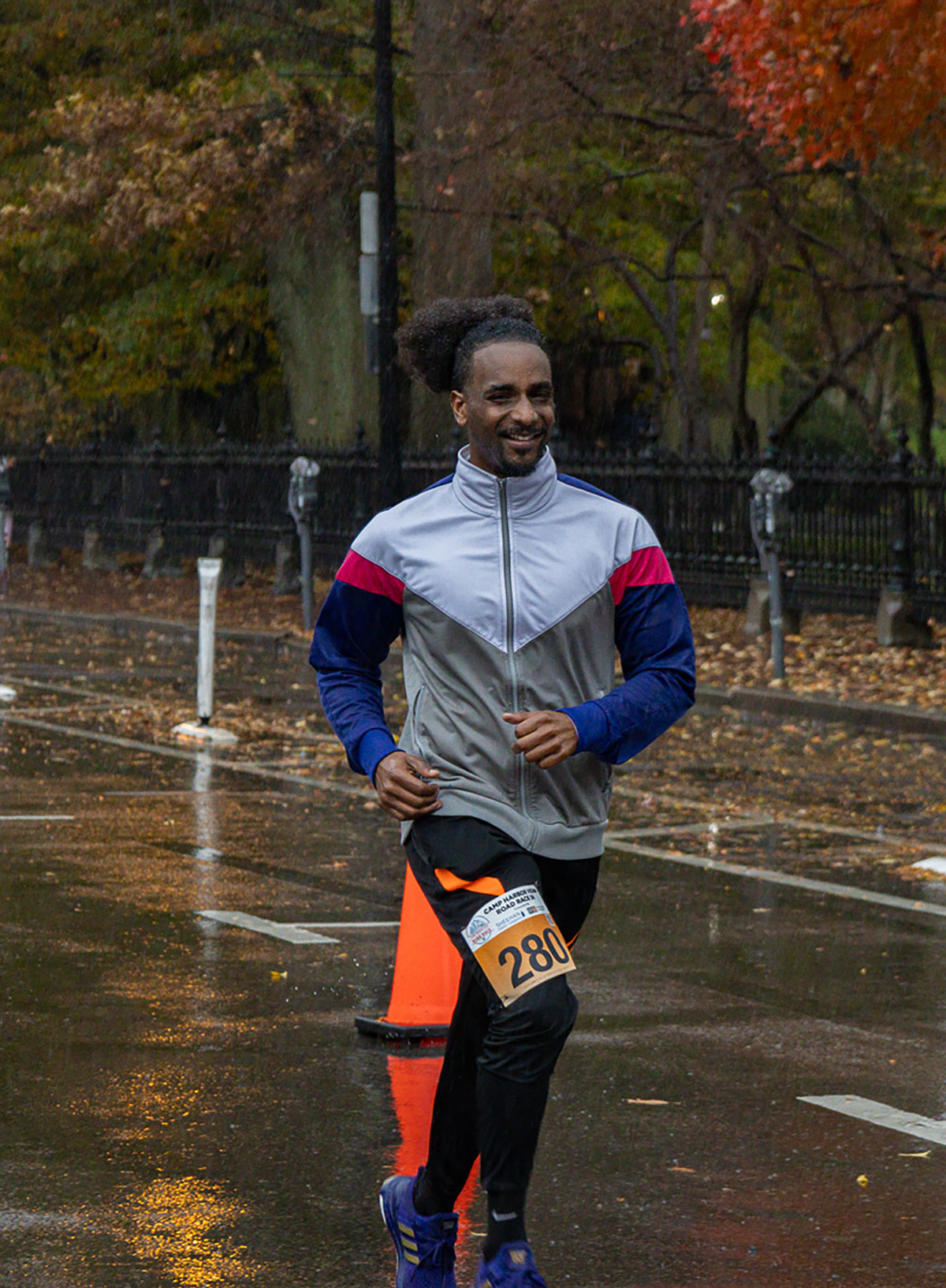 Runner smiling with track jacket on 
